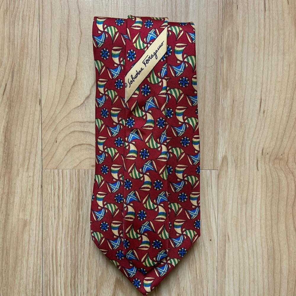 Men’s burgundy Ferragamo silk tie with sailboats.